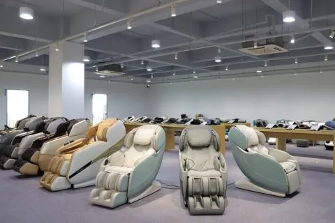 Row of massage chairs displayed in a spacious showroom.