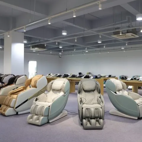 Row of massage chairs displayed in a spacious showroom.