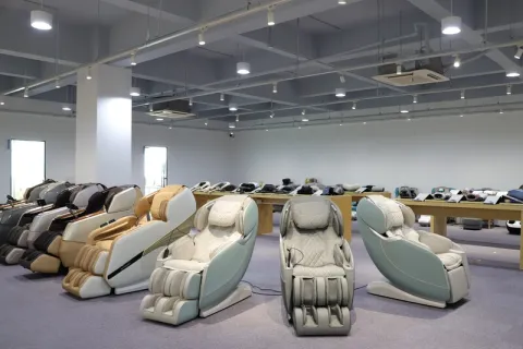 Row of massage chairs displayed in a spacious showroom.