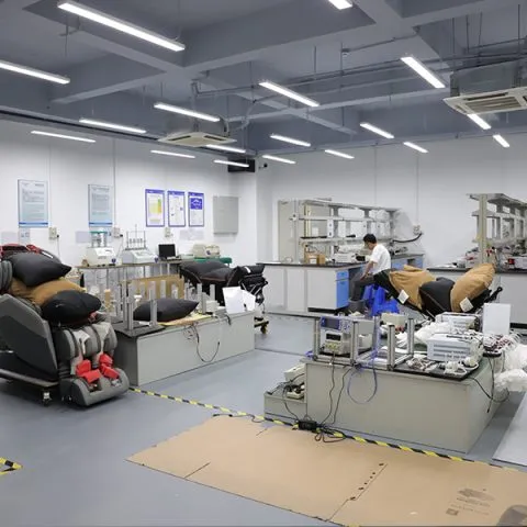Massage chairs connected to test benches and instruments in the Forrest product testing laboratory.