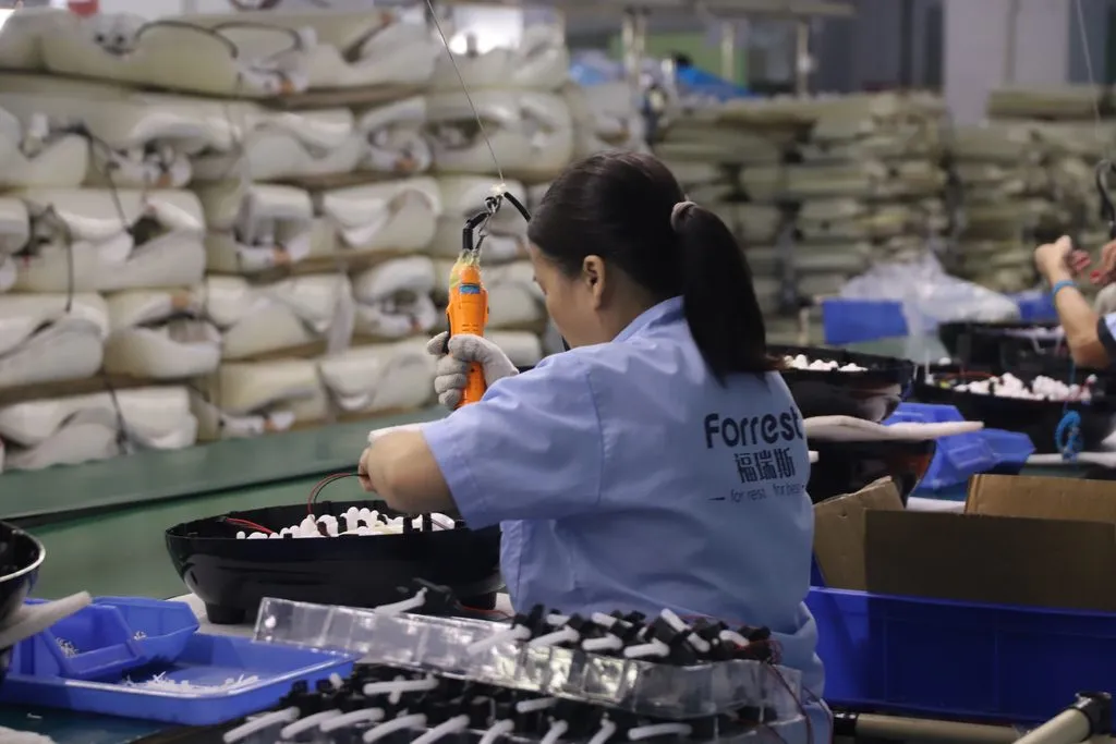 Forrest production line — skilled hands, consistent quality, every unit checked.