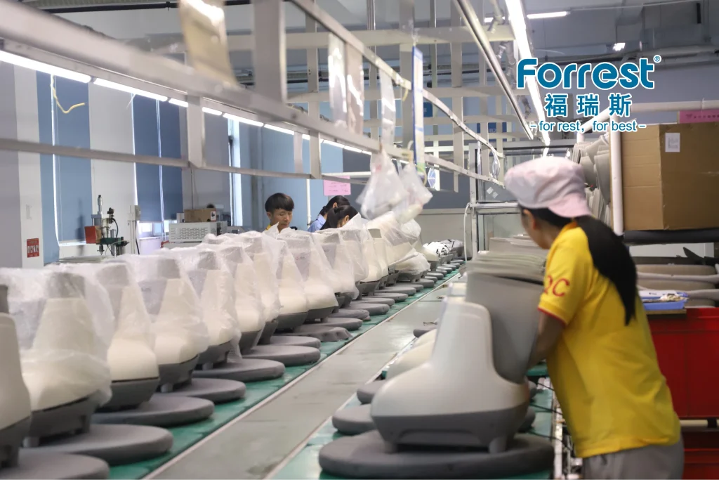 Technician performing strict quality control testing on a foot massager
